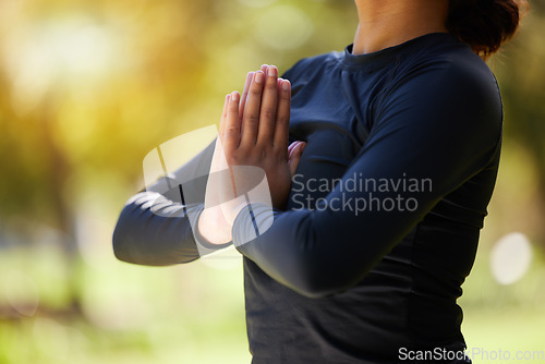 Image of Woman, hands and namaste meditation at park, wellness and freedom of chakra energy, zen fitness or peace. Closeup girl, yoga exercise and praying in nature for mental health, hope and balance mindset