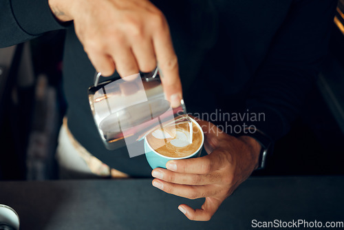 Image of Coffee, milk and hands of man in cafe for cappuccino, breakfast and caffeine beverage. Relax, espresso and dairy with barista in coffee shop and with latte for retail, mocha and drink preparation