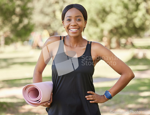 Image of Portrait of black woman in park with yoga mat and smile in nature for health and fitness mindset and care. Exercise, zen and yoga, happy face on woman ready for pilates workout on grass in summer sun