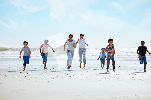 Image of Summer, beach and a group of children running on sand, friendship and fun on ocean holiday. Friends, kids and energy in youth, happy boys and girls on vacation in playful race together at the sea.