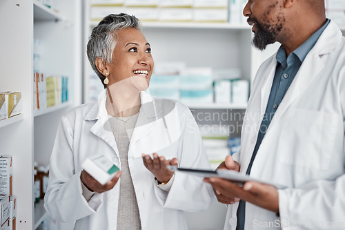 Image of Pharmacy, doctors or pharmacist with medicine for stock, inventory or supplements products check. Tablet, teamwork or happy senior healthcare people working or speaking of pills or medical drugs