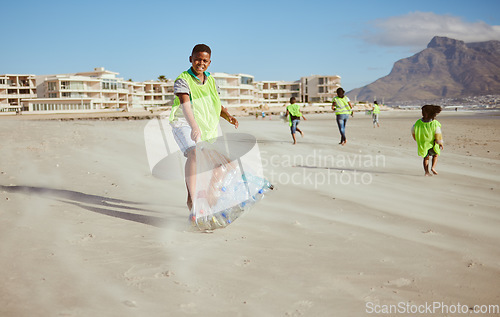 Image of Boy, portrait and trash collection bag in beach waste management, ocean clean up or sea community service. Happy kids, climate change and cleaning volunteering plastic for nature recycling for school