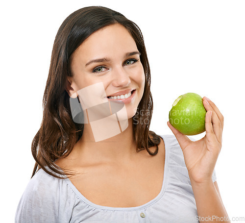 Image of Health, apple and smile with portrait of woman for nutrition, diet and weight loss choice. Fiber, food and vitamins with isolated face of girl eating fruit for wellness, organic and natural in studio