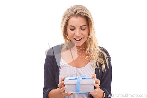 Image of Gift, present and box with a woman in studio on a white background during Christmas, a birthday or celebration event. Happy, smile and surprise with a young female holding a giftbox in wrapping paper