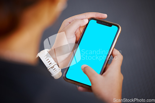 Image of Hands, phone and green screen with mockup for advertising or marketing on display screen from above. Logo, brand or social media with a mobile smartphone in the hand for blue screen product placement