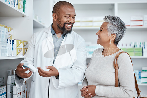 Image of Medicine, shopping or pharmacist helping an old woman with healthcare advice on medical pills or drugs. Smile, customer or happy senior doctor talking or speaking to a sick elderly person in pharmacy