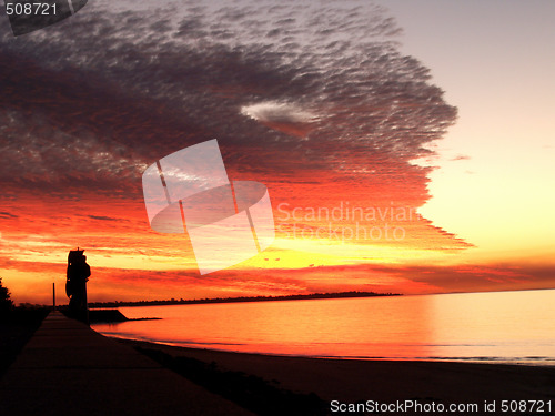 Image of Bright red sunset over the ocean - Australia