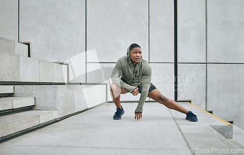 Image of Stretching, black man in the city for fitness, body training and morning motivation in New Zealand. Warm up, health exercise and African runner thinking of outdoor cardio workout idea