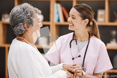 Image of Healthcare, insurance and a senior woman patient and nurse consulting during a checkup in a retirement home. Medical, support and wellness with a medicine professional talking to a mature female