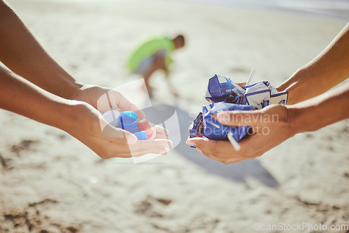 Image of Hands, trash collection and beach clean up help for climate change wellness, environment sustainability or global warming change. Zoom, cleaning people and holding plastic garbage for ocean recycling