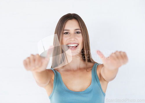 Image of Portrait, young woman and thumbs up with smile, celebration and girl isolated on white studio background. Female, lady and gesture for agreement, happiness or winner with success, relax or motivation