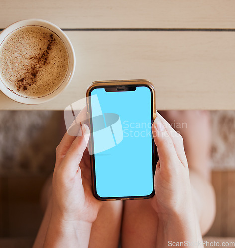 Image of Coffee, phone and hands of girl with green screen mock up at home to relax with online app zoom. Streaming, social media or news advertising screen with smartphone and drink of woman on internet