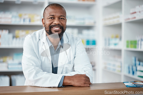 Image of Medicine, healthcare and portrait of black man at pharmacy for trust, insurance and prescription. Wellness. medication and male pharmacist with pills, vitamins and tablets in hospital dispensary