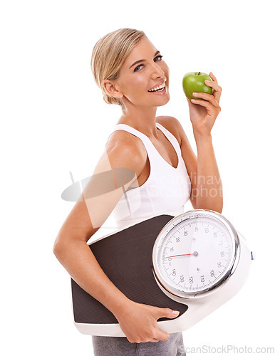 Image of Woman, apple and carrying scale for diet, weight loss or healthy nutrition against a white background. Portrait of happy isolated female with smile for organic, vitamins and dieting food for measure