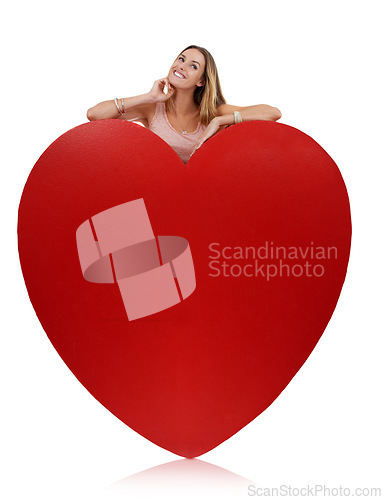 Image of Heart, in love and woman happy with freedom and funny excited feeling behind sign. Model, white background and comic young person with happiness, joy and smile for romance and beauty isolated