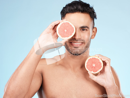 Image of Beauty, health and portrait of man with grapefruit for fruit detox, healthy body or natural facial skincare routine. Wellness spa salon, vitamin c glow and happy nutritionist model with food product