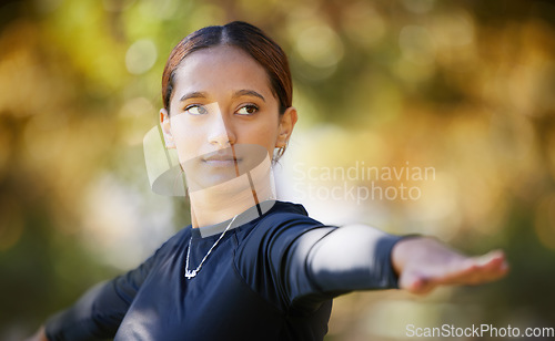 Image of Balance, fitness yoga and woman in nature for exercise, body freedom and zen with a workout in Australia. Warrior pose, focus and outdoor pilates for a girl training in a park for health and wellness