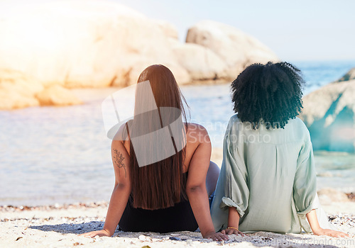 Image of Women, lgbtq and back view at beach for love, care and summer holiday, vacation and travel. Gay, lesbian and couple of friends relax on sea sand, ocean and outdoor sunshine in nature, peace and calm