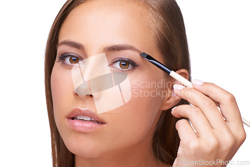 Image of Woman, face and makeup with eyebrow and brush for beauty, microblading and mascara on white background. Portrait, lashes and eyes with cosmetic care and cosmetics tools with skincare in studio