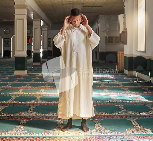 Image of Muslim, prayer or man in a mosque praying to Allah for spiritual mindfulness, support or wellness in Doha, Qatar. Religion, peace or Islamic person in temple to worship or praise God with gratitude