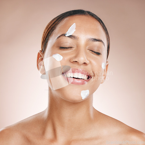 Image of Skincare, cream and black woman in studio for beauty, cosmetics or healthy glow with product advertising. Young, happy model with sunscreen results, dermatology skin care or facial collagen promotion