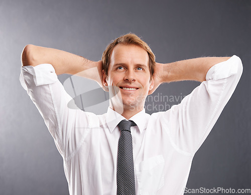 Image of Business man, happy and thinking to relax with a smile and idea for future, vision and career in studio. Face of a male entrepreneur with hands behind head to think about decision, ideas or choice