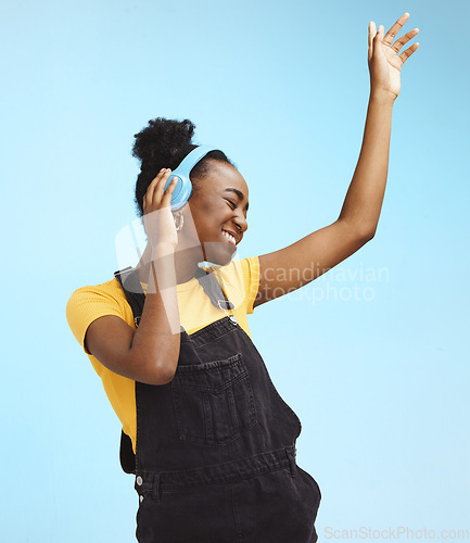 Image of Music, dance and freedom with black woman and headphones feeling celebration, relax and streaming. Audio, smile and technology with girl listening to online radio for playlist, energy and happy