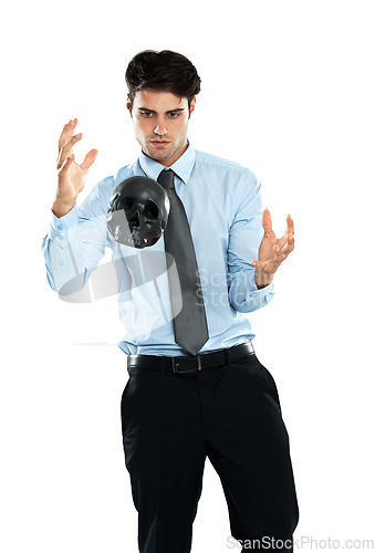 Image of Business man, levitation and black skull in studio isolated on a white background. Magician, spirit and male employee levitating head or scalp in air for evil, death or occult, voodoo or magic trick.