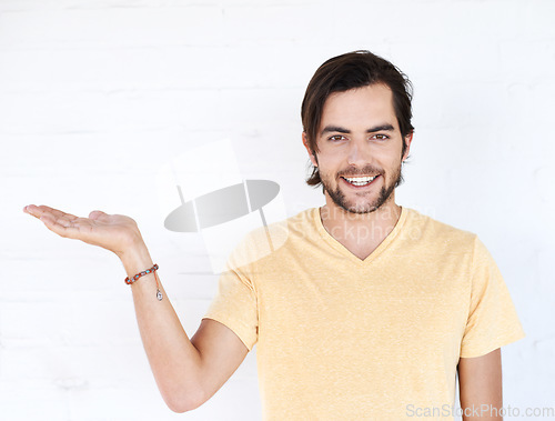 Image of Mockup gesture, studio portrait and happy man with sales promo, luxury present gift or discount deal mock up. Marketing space, product placement or advertising model isolated on white background wall