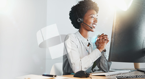 Image of Call center, black woman and smile with headphones, office and customer service for consulting help at job. Woman, crm expert and customer support by computer, focus and telemarketing work in Atlanta
