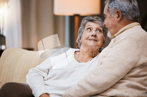 Image of Love, sofa and senior couple talking, marriage and bonding for relationship, retirement and romance. Romantic, elderly man and mature woman in living room, conversation and relax on weekend break.