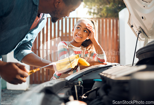 Image of Car problem, child and dad working as a mechanic while teaching daughter to change motor oil and fix vehicle. Black man and girl kid learning, talking and bonding while busy on engine for transport