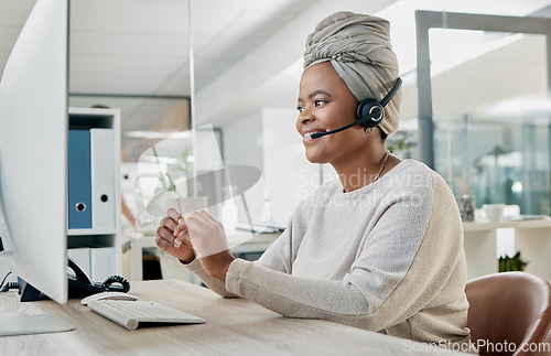 Image of Crm, contact us or black woman in call center at customer services for a communication or telemarketing agency. Computer, microphone or African consultant talking, helping or speaking at office desk