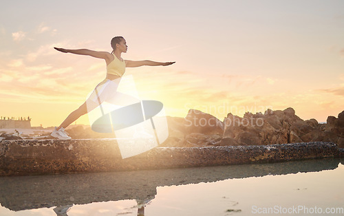 Image of Beach, yoga or woman stretching in fitness training, body workout or exercise for natural balance in Miami, Florida. Mindfulness, breathing or healthy zen girl exercising at sunset with calm peace