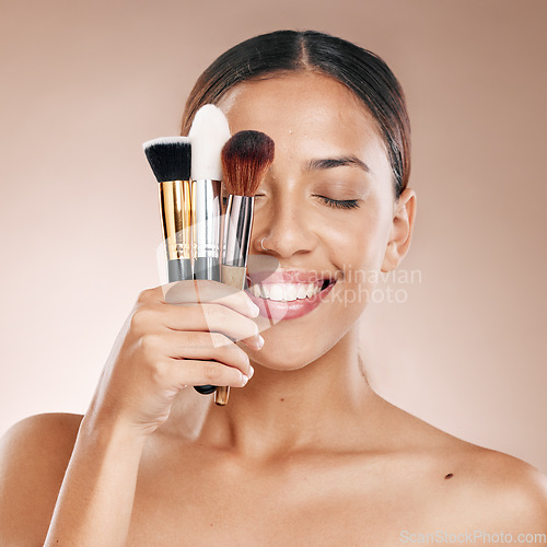 Image of Makeup, tools and brush with face and woman, beauty cosmetics and wellness against studio background. Facial, treatment and cosmetic equipment, smile and microblading with skincare mockup