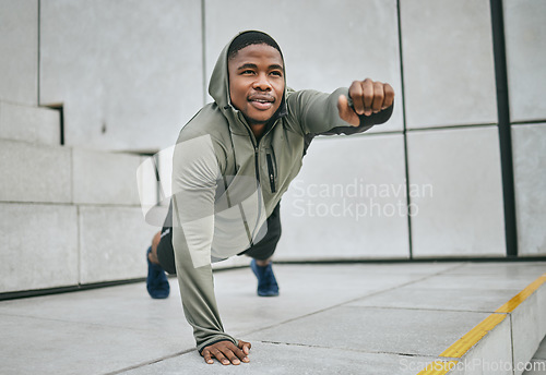 Image of Fitness, plank and black man training in the city for a body goal, morning workout and urban cardio in Morocco. Exercise, strong and African man with sports vision, balance and strength training