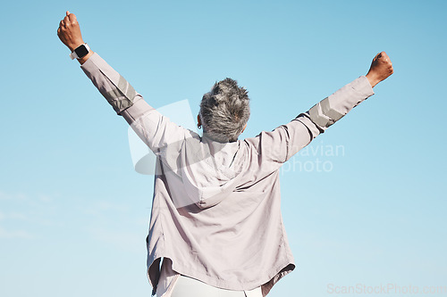 Image of Freedom, fitness and woman hands in air on blue sky mockup for exercise, fitness or workout training goals, success and achievement. Winner, wow and healthy senior or runner rear in nature wellness