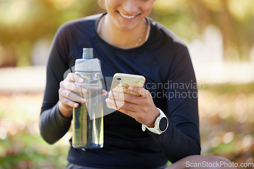 Image of Water bottle, smartphone and woman in park for fitness website app, blog or social media exercise, workout or training update. Healthy, nutrition and cellphone technology or gear of runner in nature