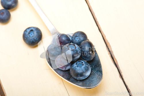 Image of fresh blueberry on silver spoon