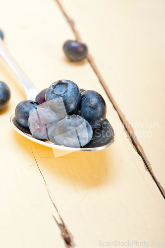 Image of fresh blueberry on silver spoon