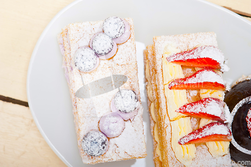 Image of selection of fresh cream cake dessert plate