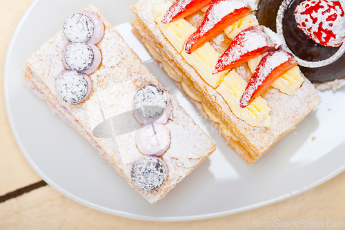 Image of selection of fresh cream cake dessert plate