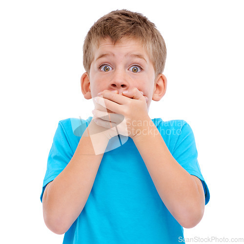 Image of Shock, surprise and boy child in a studio with a wow or omg facial expression with his hands on his mouth. Shocked, news and portrait of a surprised young kid model isolated by a white background.