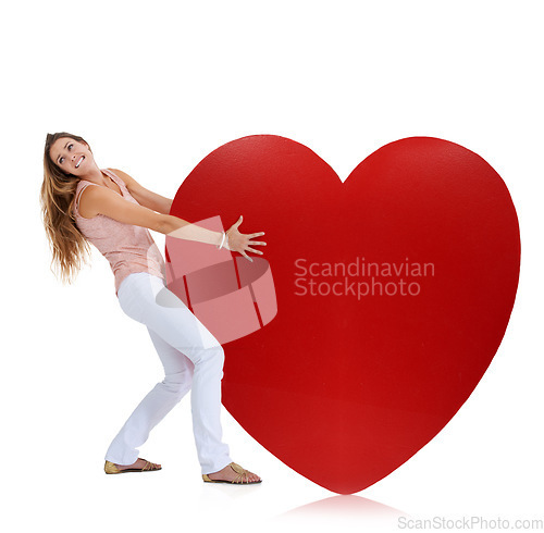 Image of Love, studio and woman pull heart isolated on a white background. Beauty, fashion and young female model pulling heavy symbol or sign for romance emoji, affection or romantic passion, care or empathy