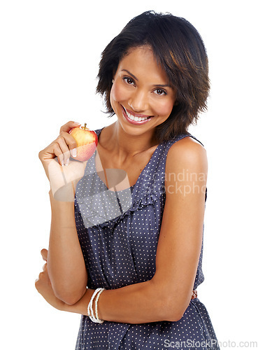 Image of Portrait, food or black woman eating an apple in studio on white background with marketing mockup space. Smile, organic or happy African girl advertising healthy fruit diet for self care or wellness