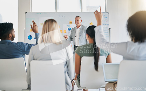 Image of Business, speaker and presentation for workshop, conference and questions. Staff, leader or man in meeting with staff, teamwork and seminar for new process, system training or charts for sales growth