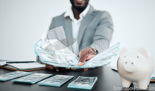 Image of Hand, dollars and businessman with money for bribe in office. Finance, currency and black man offering cash for financial investment, payment or banking, deal or savings, loan or money laundering.