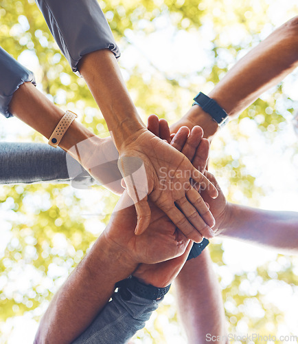 Image of Hands, together and support with solidarity outdoor and group, diversity and team building in nature. Trust, respect and mission with community and hand stack low angle, collaboration and motivation.