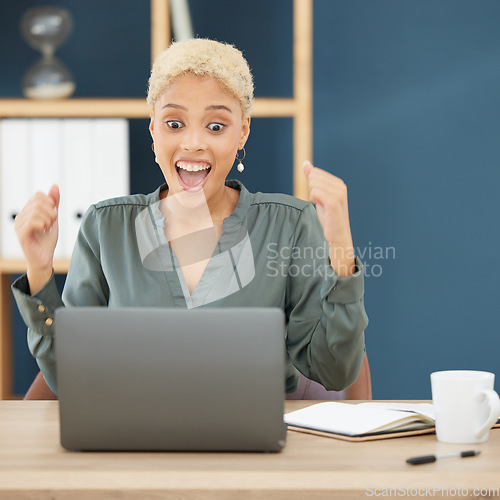 Image of Wow, successful black woman celebrating at desk in New York business office with shocked face. Happy lawyer reading email on laptop, professional work achievement and corporate success in career