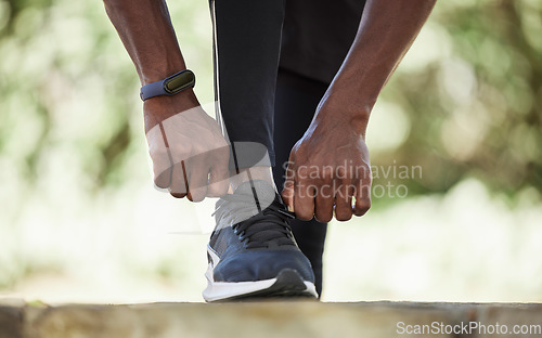 Image of Black man with sneakers, runner and exercise outdoor with fitness run and healthy lifestyle, wellness with athlete and sport. Runner, workout shoes and body training with sports motivation and cardio